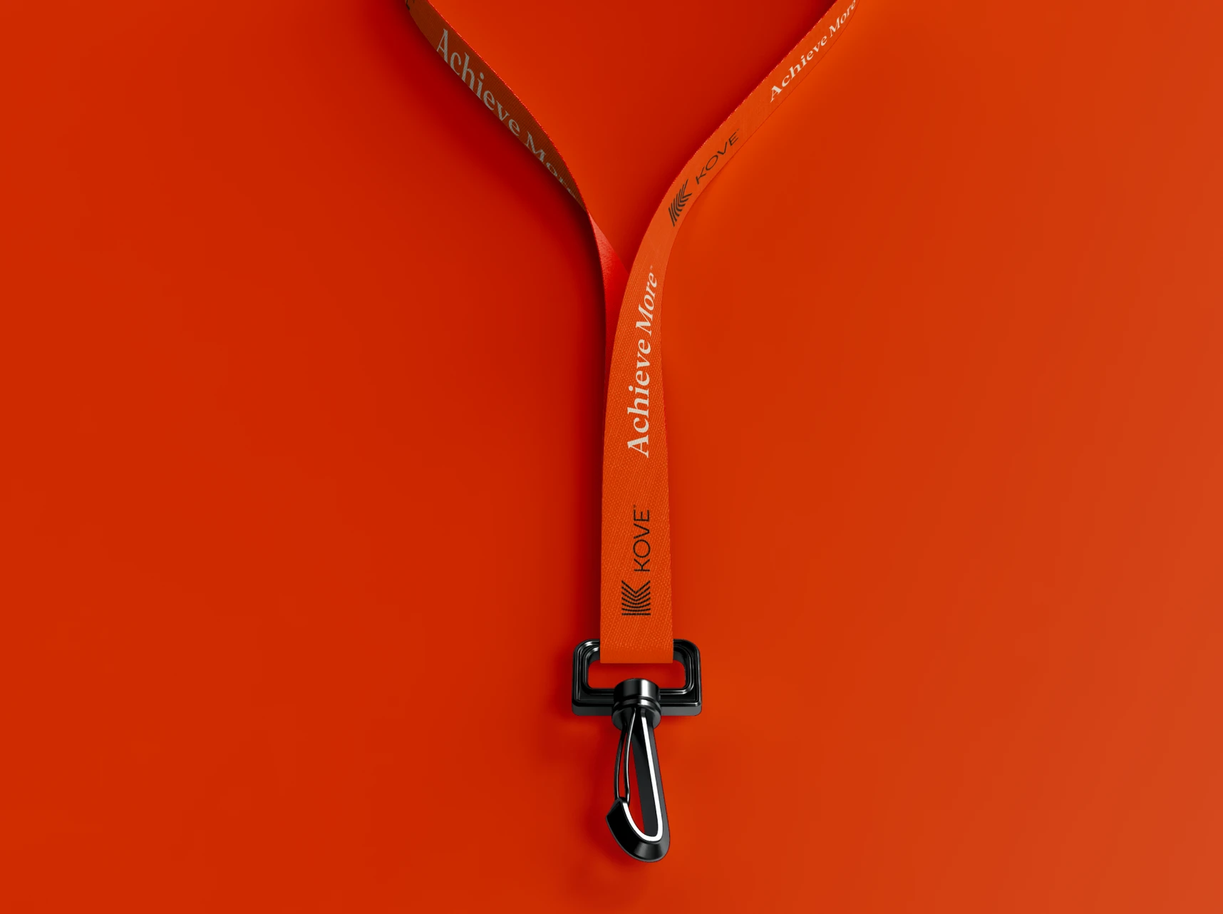 Kove lanyard with "Achieve More" text on an orange background.
