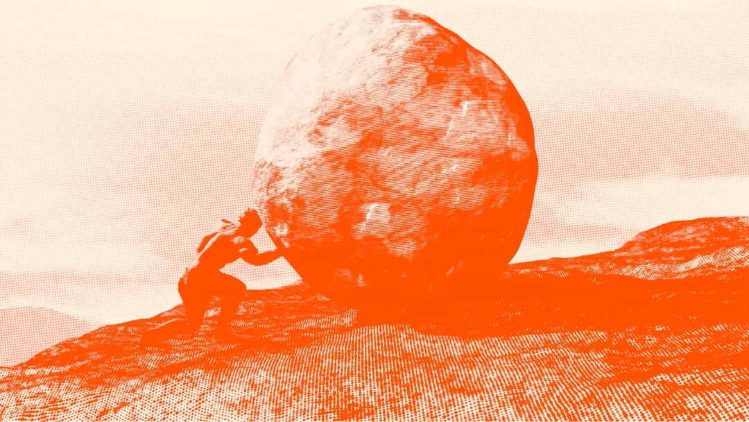 Stack of pancakes with berries and syrup at a brunch spot.