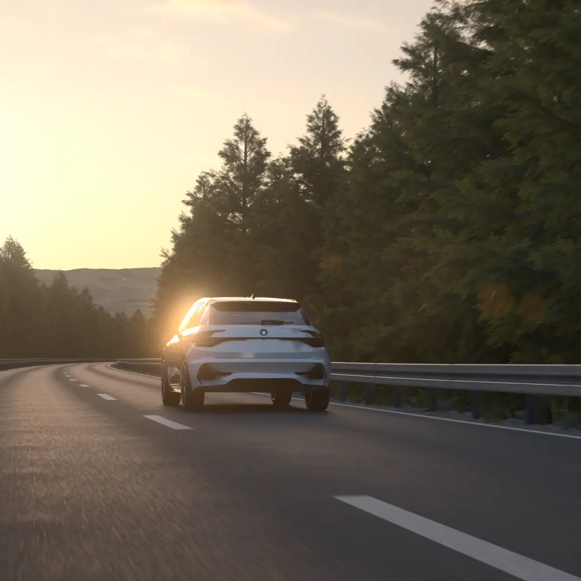 Silver car driving on a highway at sunset, surrounded by trees.