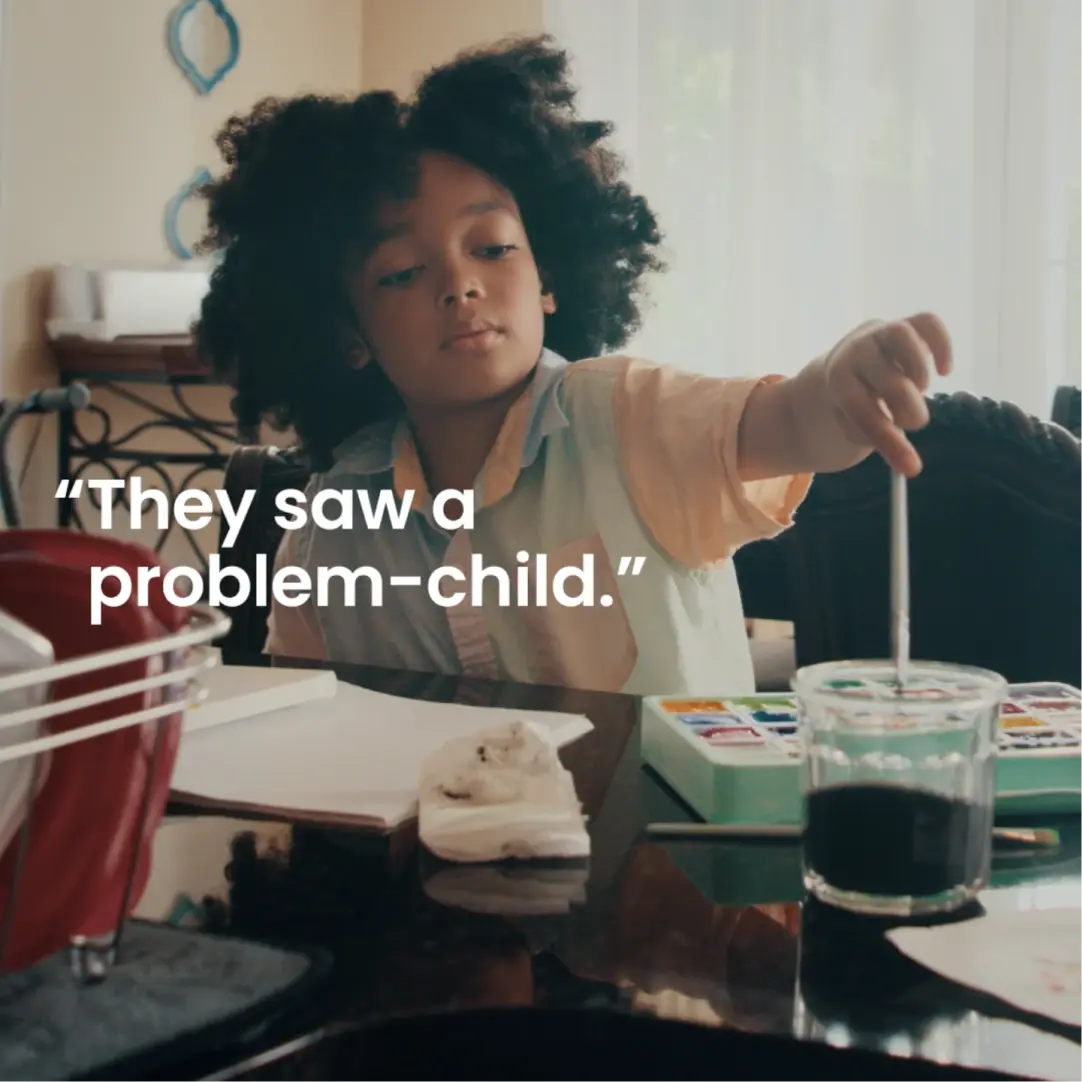 Child painting with watercolors; text: "They saw a problem-child.