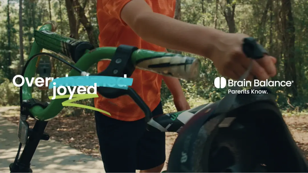 Boy with bike and helmet, Brain Balance Parents Know.