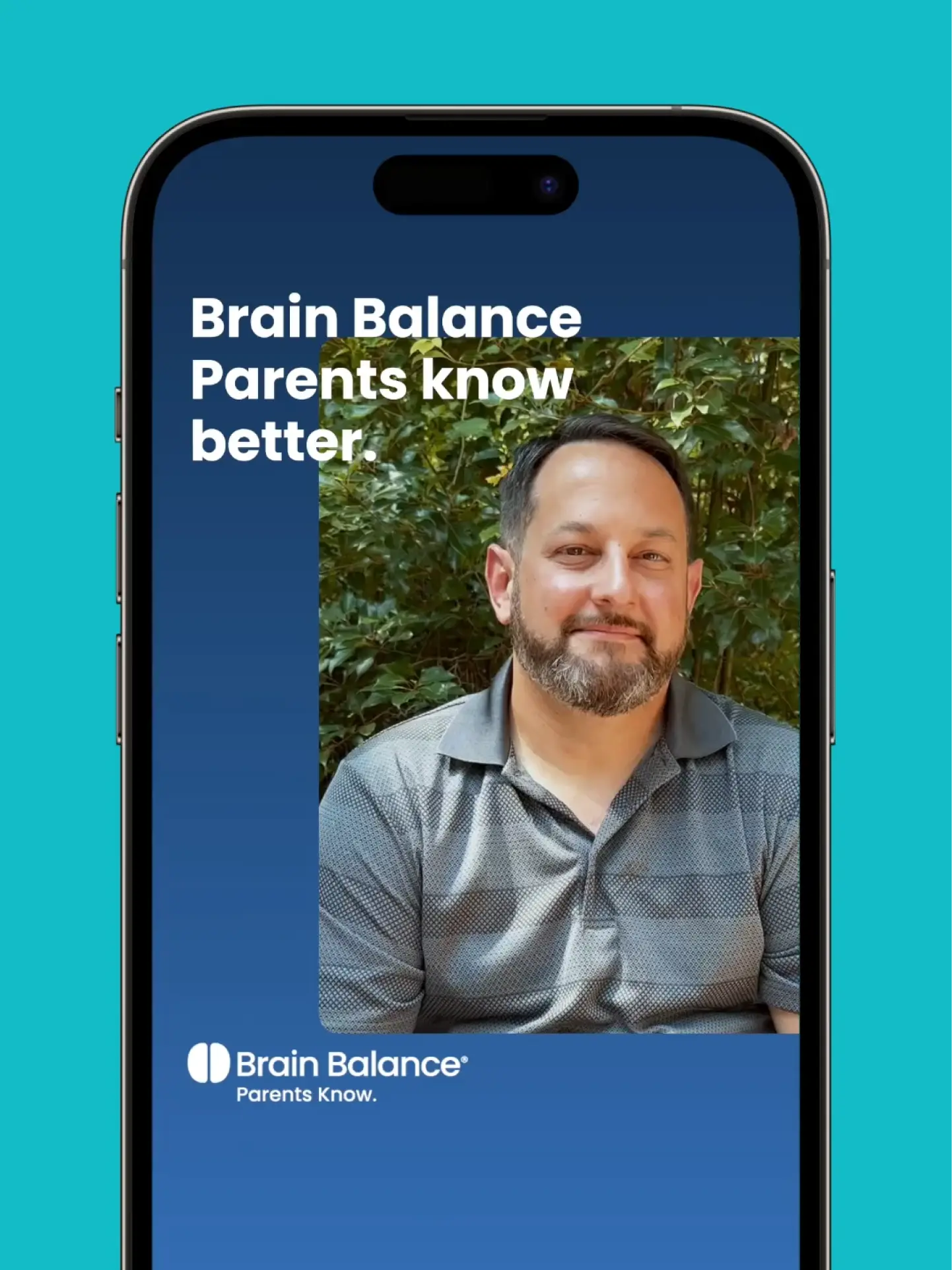 Brain Balance: Man smiles in front of greenery. Parents Know.