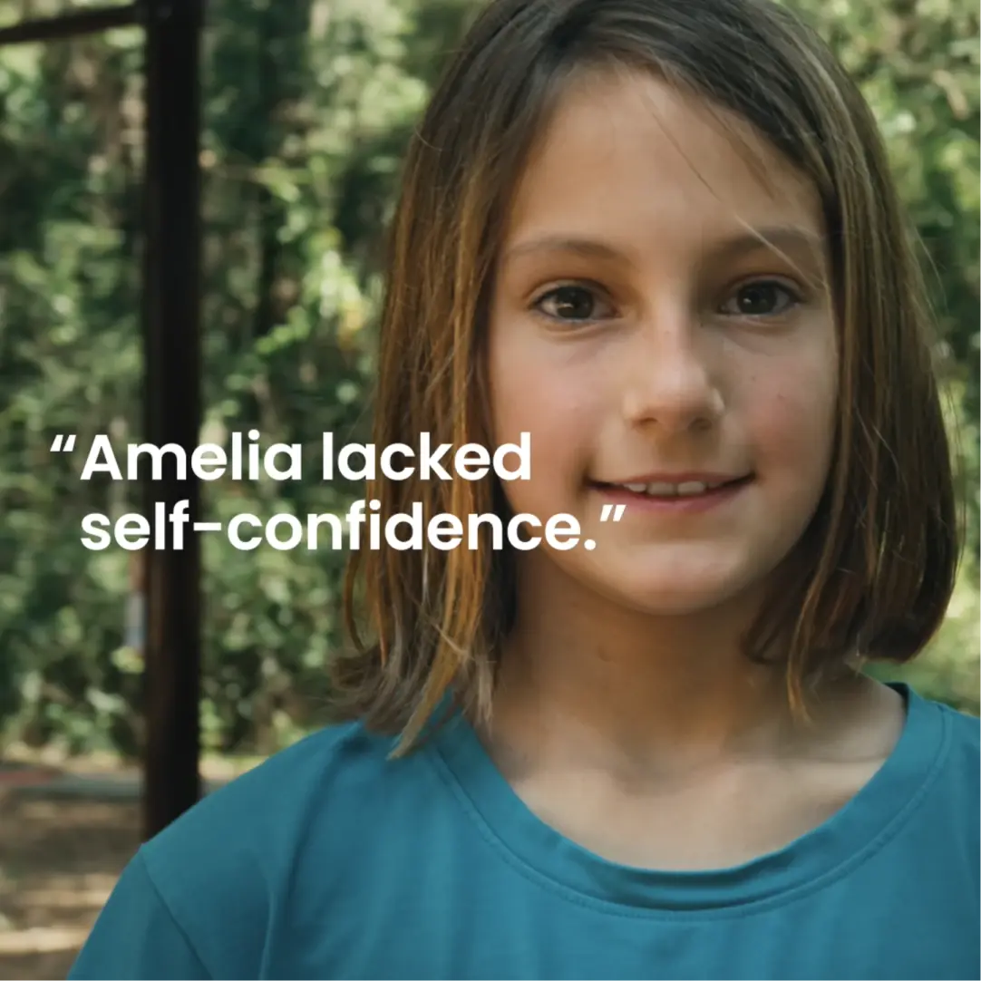 Girl with a slight smile. Text: "Amelia lacked self-confidence.