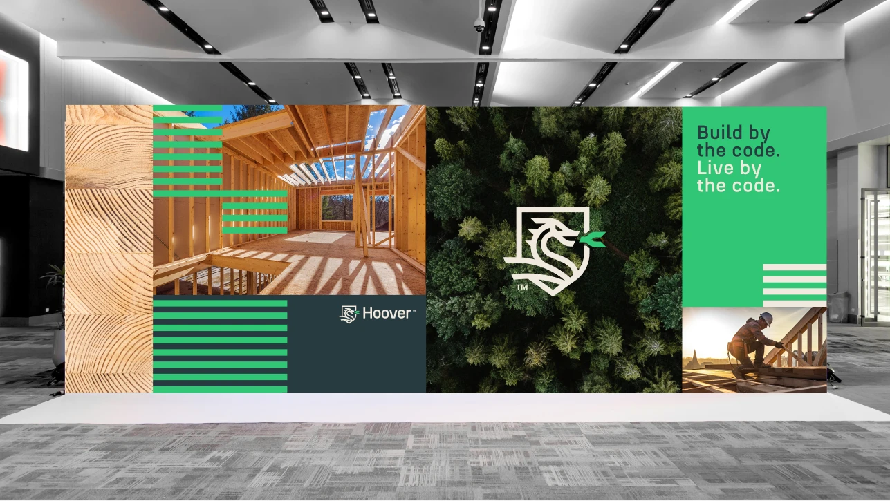 Hoover building materials display with wood, construction, and forest imagery. Build by the code. Live by the code.